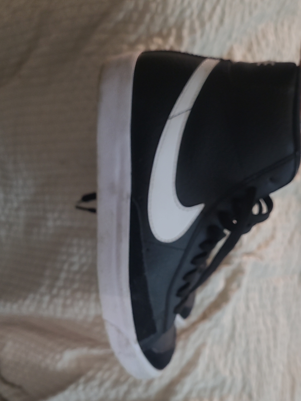 Nike Black High-Top Sneaker with White Swoosh